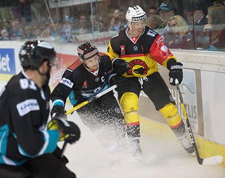 Philipp Lukas (EHC Liwest Black Wings Linz) und defenseman Jeremie Kamerzin #57 of SC Bern,  EHC Liwest Black Wings Linz vs SC Bern